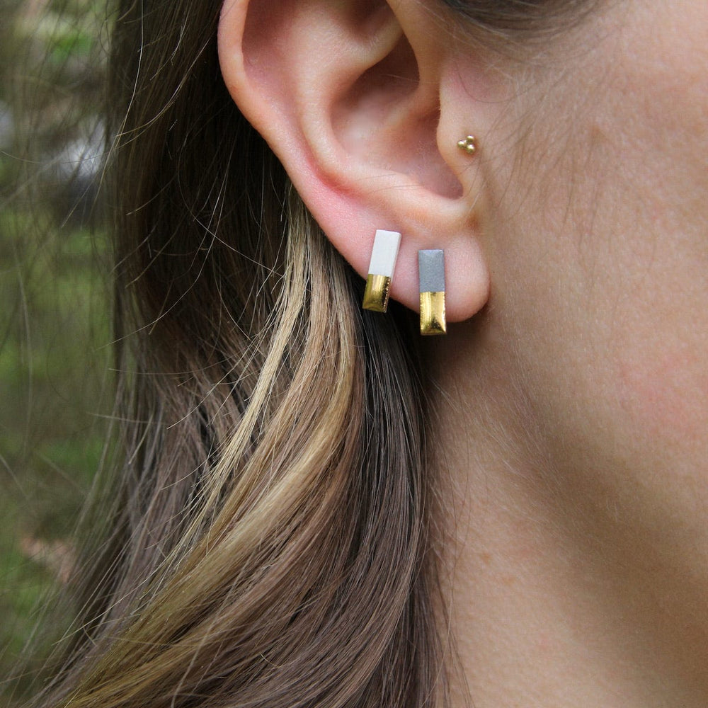 
                      
                        EAR-GF Grey Gold Dipped Bar Studs
                      
                    