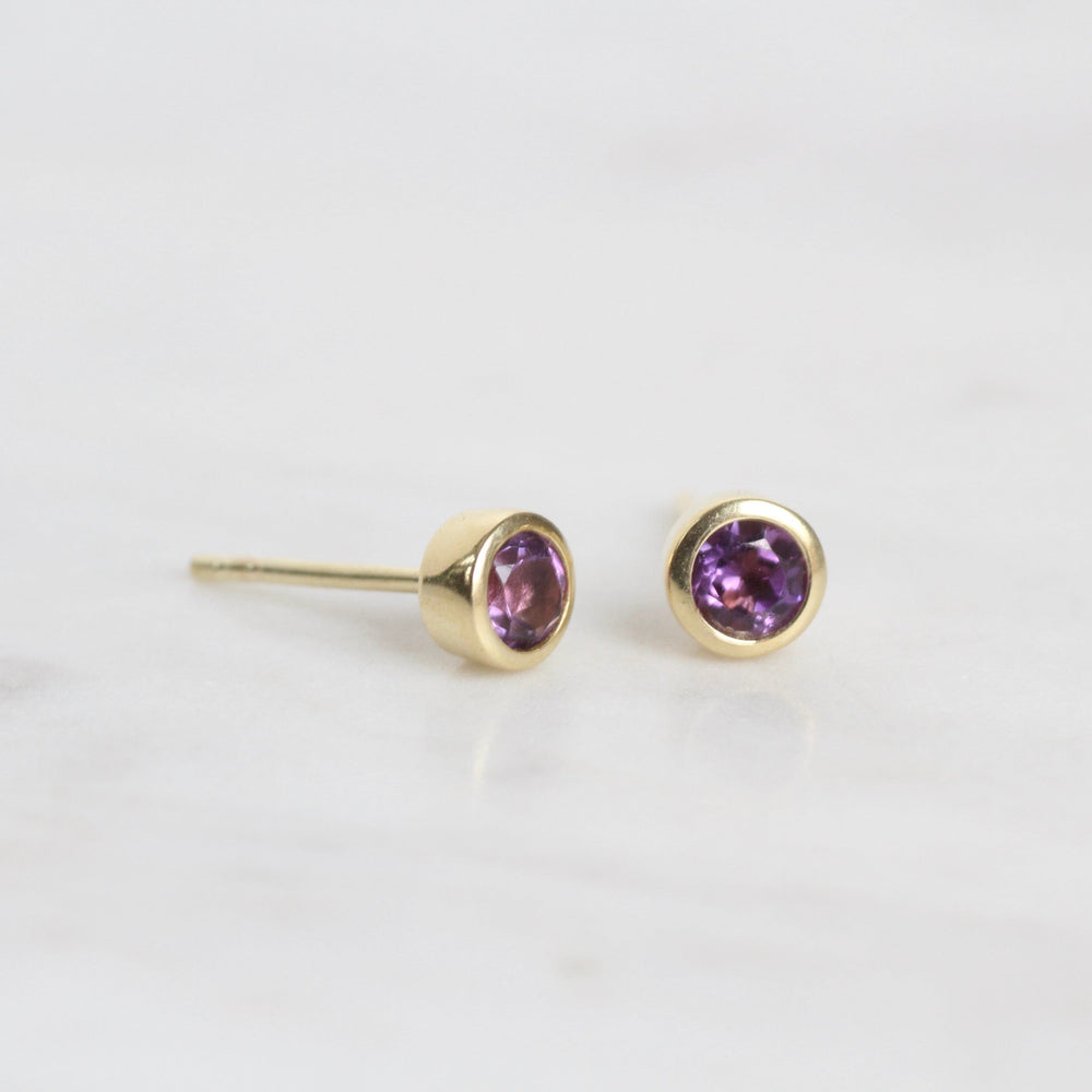 
                      
                        EAR-GPL Mini Amethyst Dot Post Earring ~ Gold Plated
                      
                    