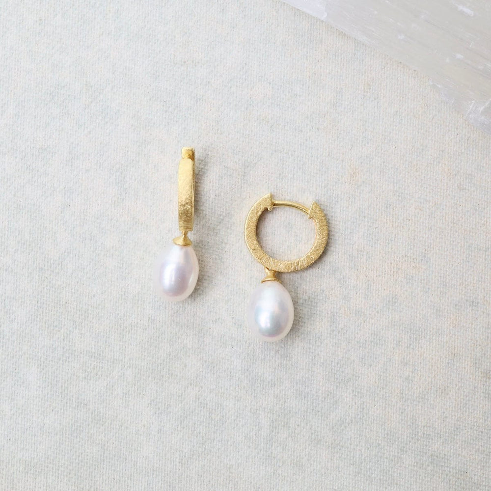 
                      
                        EAR-GPL White Pearl Huggie Earrings
                      
                    