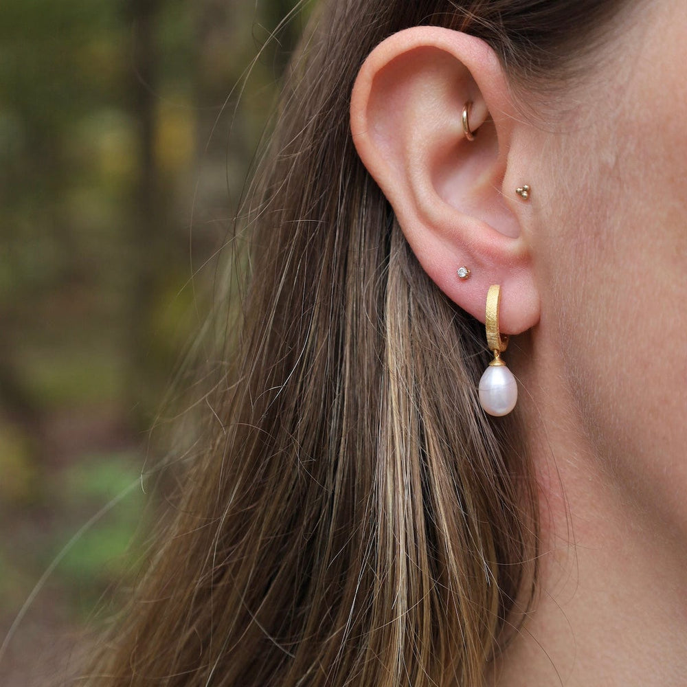 
                      
                        EAR-GPL White Pearl Huggie Earrings
                      
                    