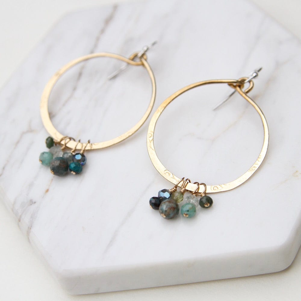 
                  
                    EAR Hand Formed Bronze Ring with clusters of Apatite Earring
                  
                