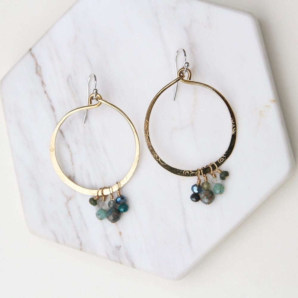 
                  
                    EAR Hand Formed Bronze Ring with clusters of Apatite Earring
                  
                