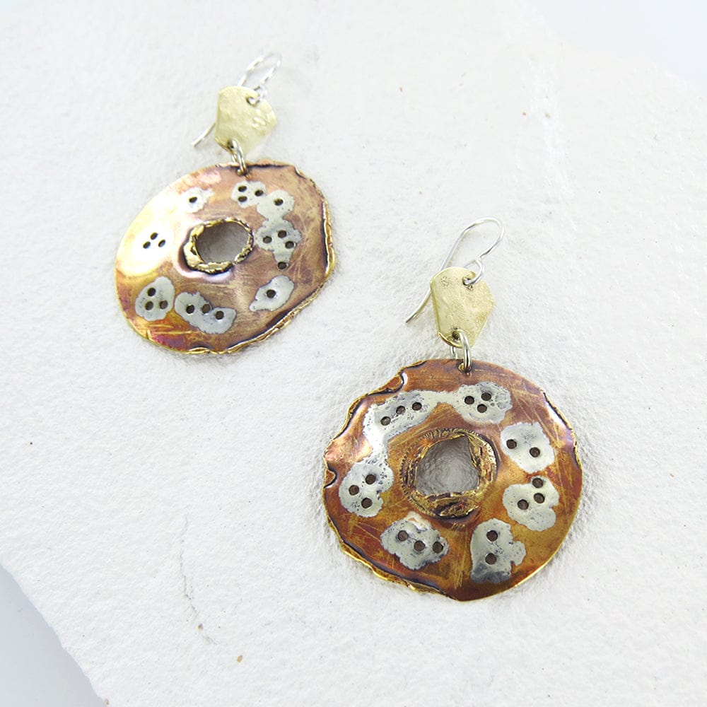 
                  
                    EAR HEAT TREATED DISC EARRINGS
                  
                