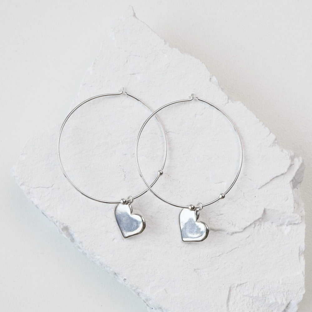 
                      
                        EAR Hoops With Heart Drop in Sterling Silver
                      
                    