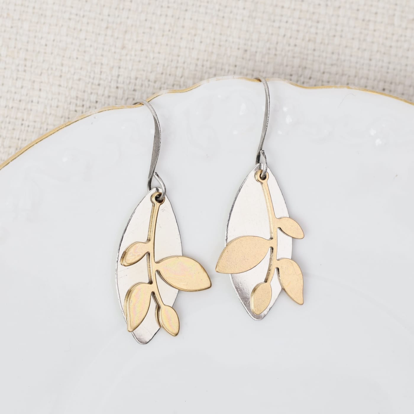 EAR-JM Elongated silver sphere w/ golden leaf branch earr
