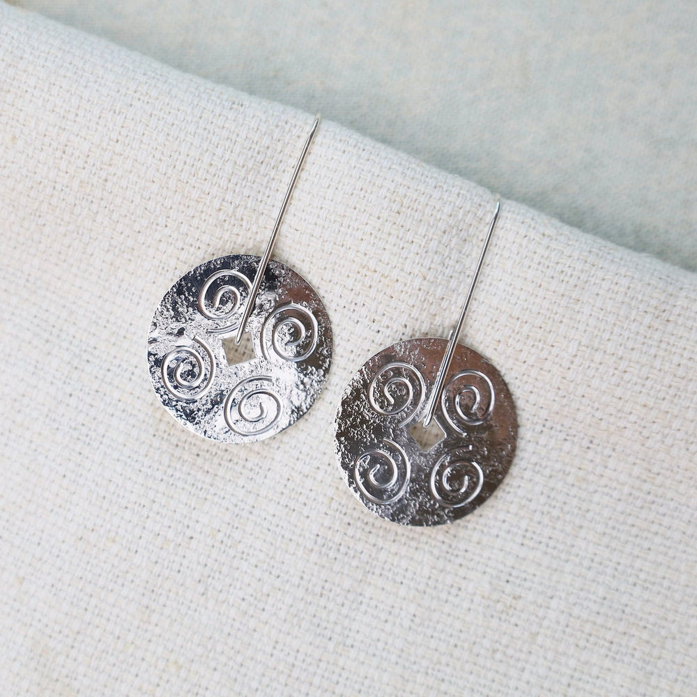 
                      
                        EAR Large Disc with Swirls Long Earrings
                      
                    