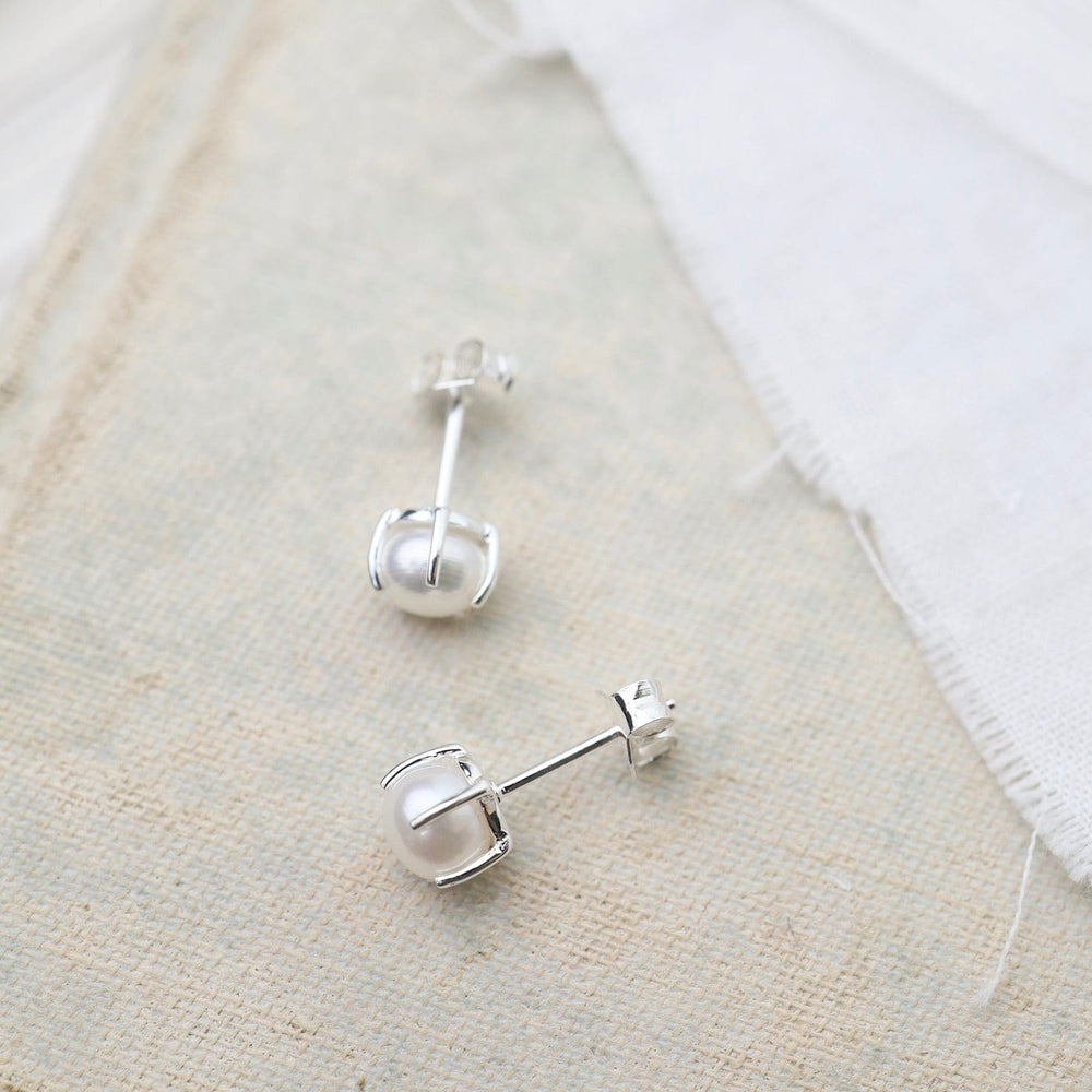 
                      
                        EAR Large Prong-Set Freshwater White Pearl Studs
                      
                    