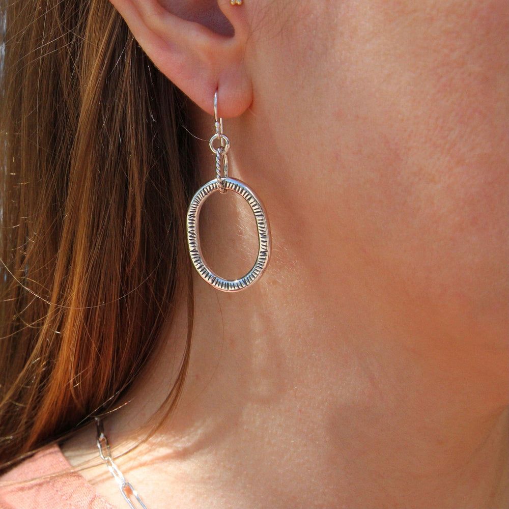 
                      
                        EAR Large Textured Oval Hoops
                      
                    