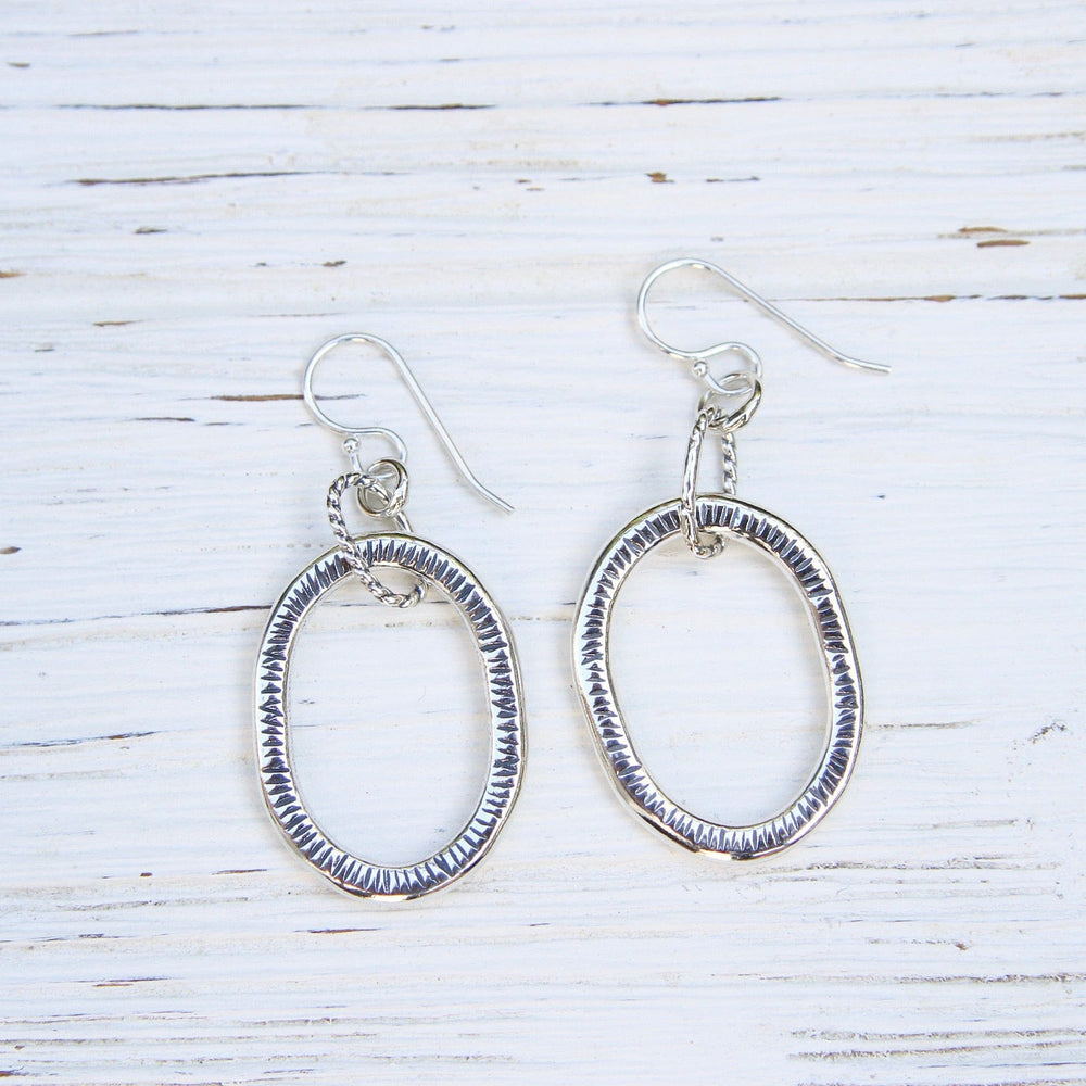 
                      
                        EAR Large Textured Oval Hoops
                      
                    