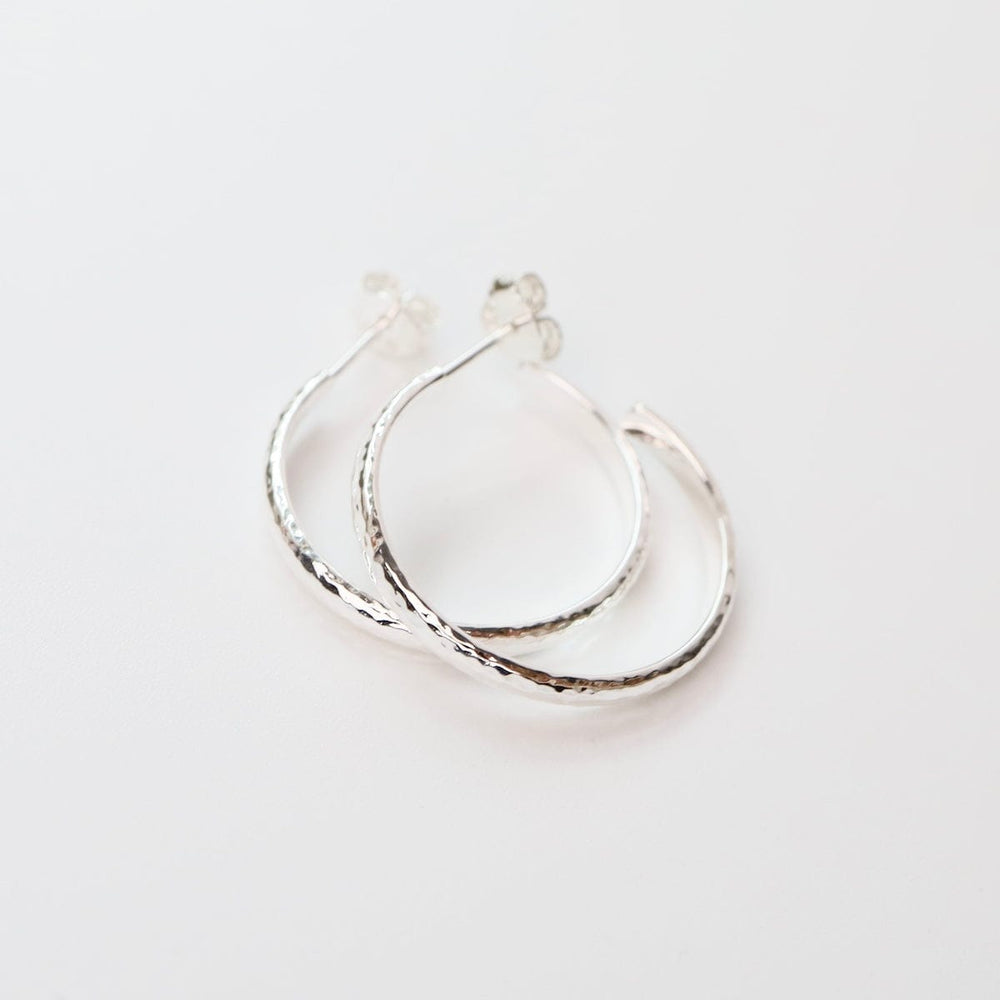 
                  
                    EAR Medium Finely Hammered Hoops in Sterling Silver
                  
                