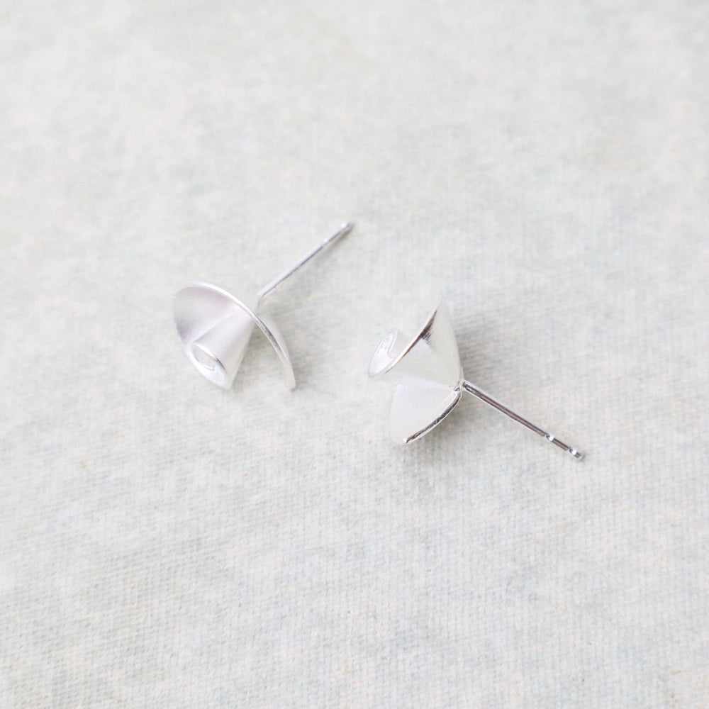 
                  
                    EAR Nautilus Stud Earrings
                  
                