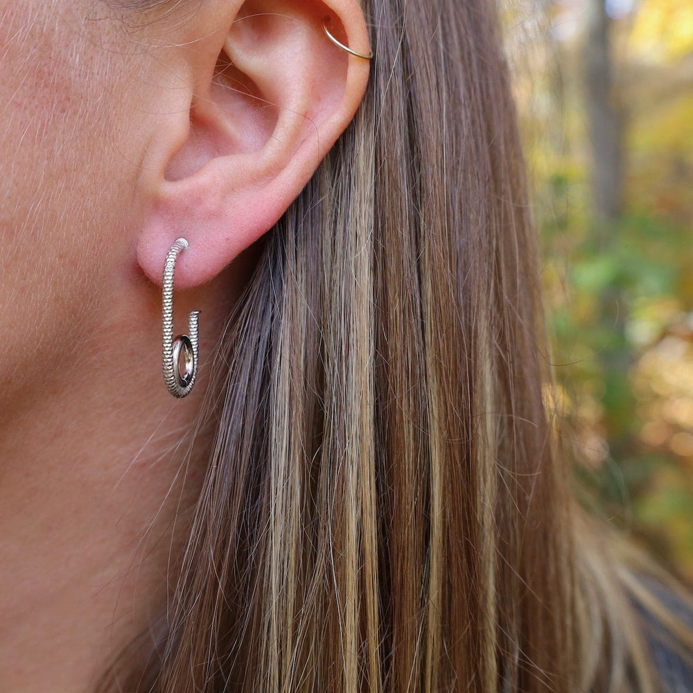 
                      
                        EAR Pipe Hoop Earrings
                      
                    