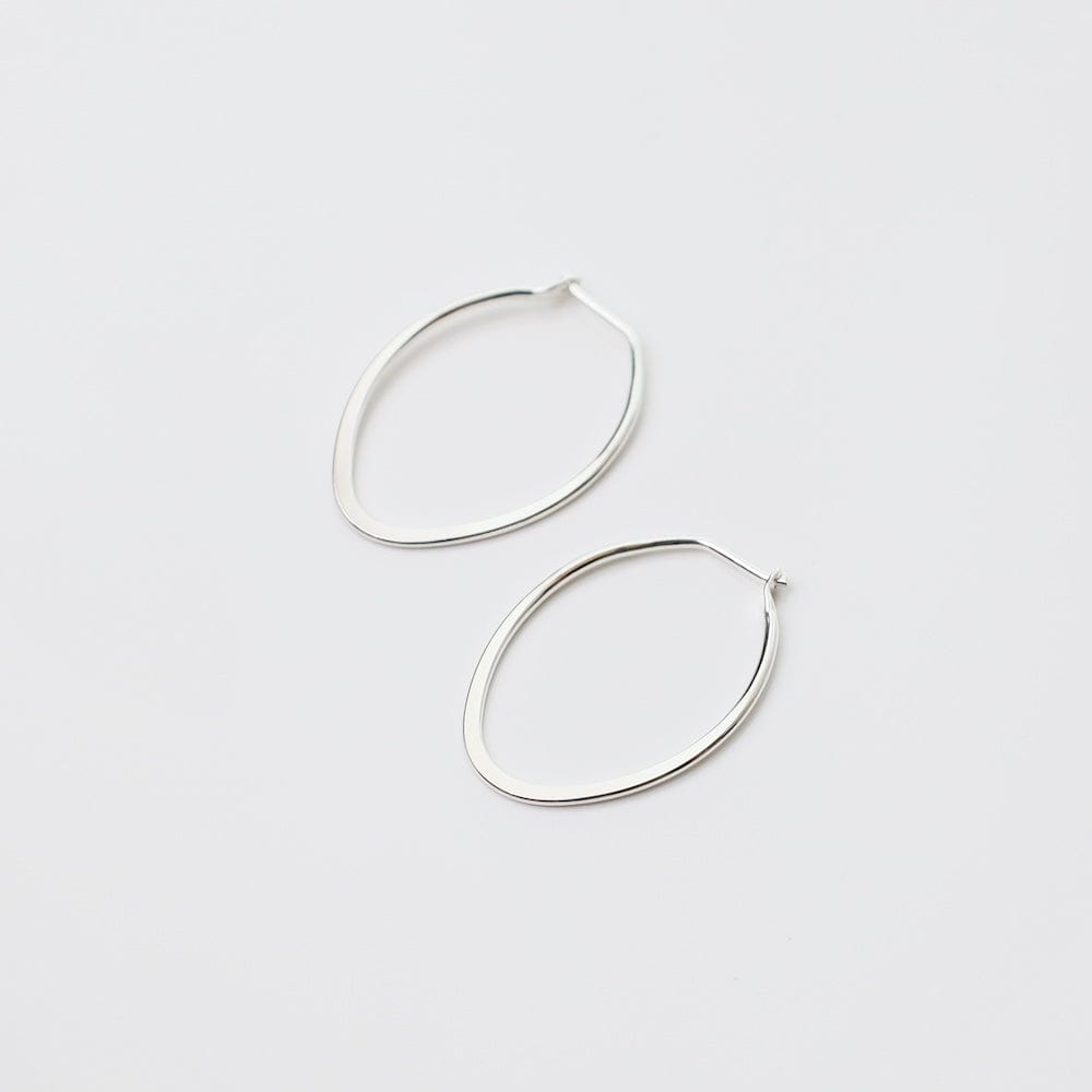 
                  
                    EAR Small Flattened Oval Hoop Earrings in Sterling Silver
                  
                