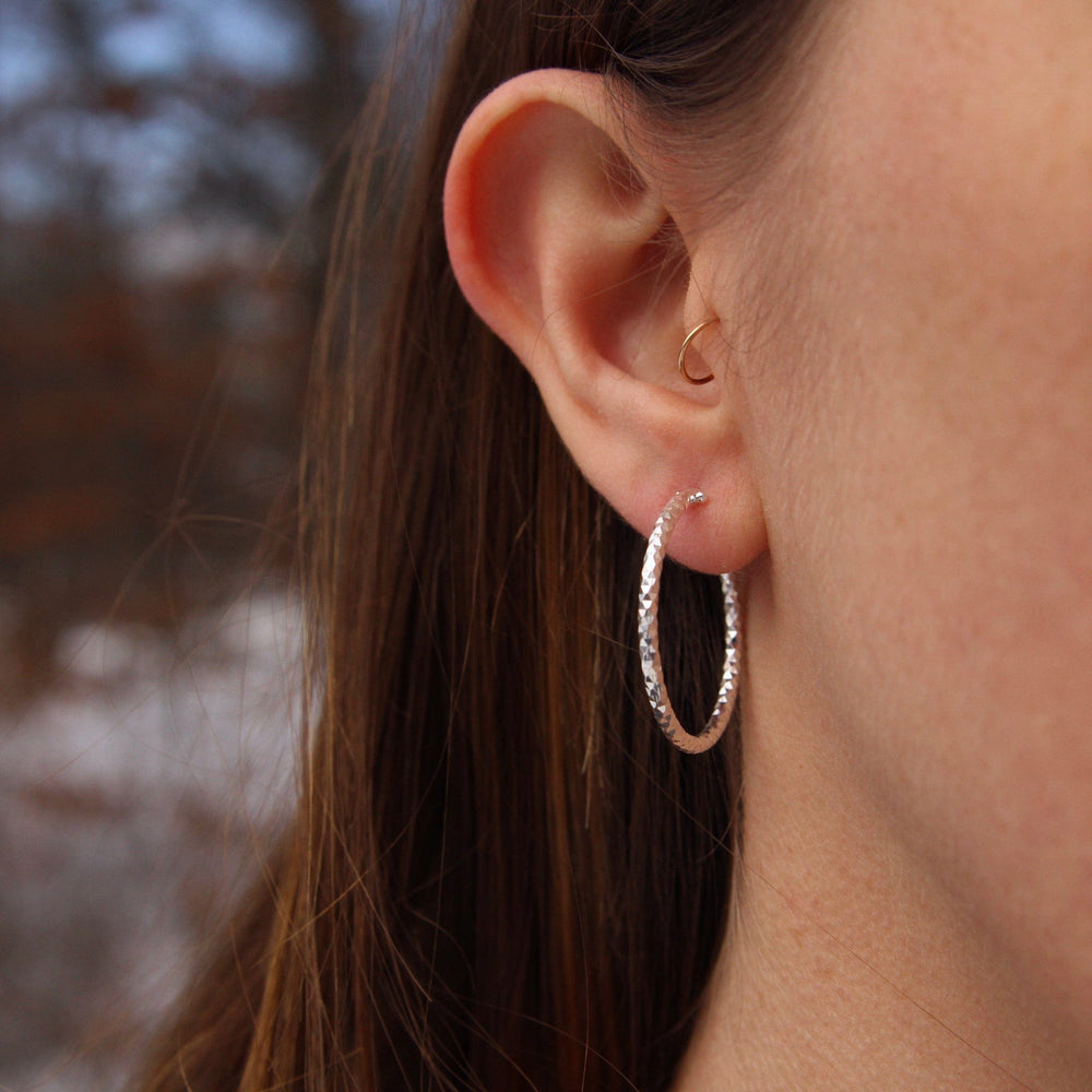 
                  
                    EAR Small Sterling Silver Faceted Hoops
                  
                