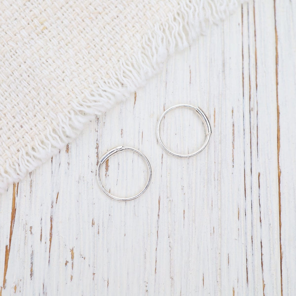 
                  
                    EAR Sterling Silver 10mm Sleeper Hoops
                  
                