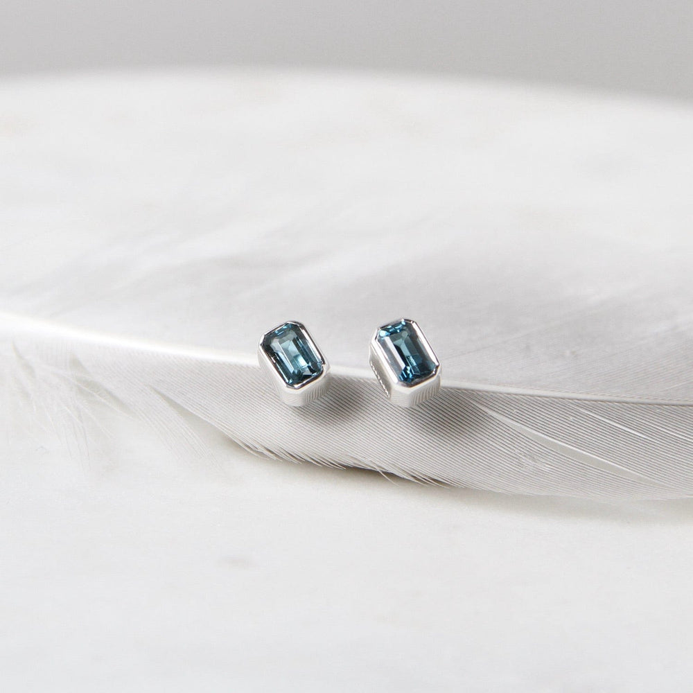 
                      
                        EAR Sterling Silver Bezel Set Emerald Cut London Blue Topaz
                      
                    