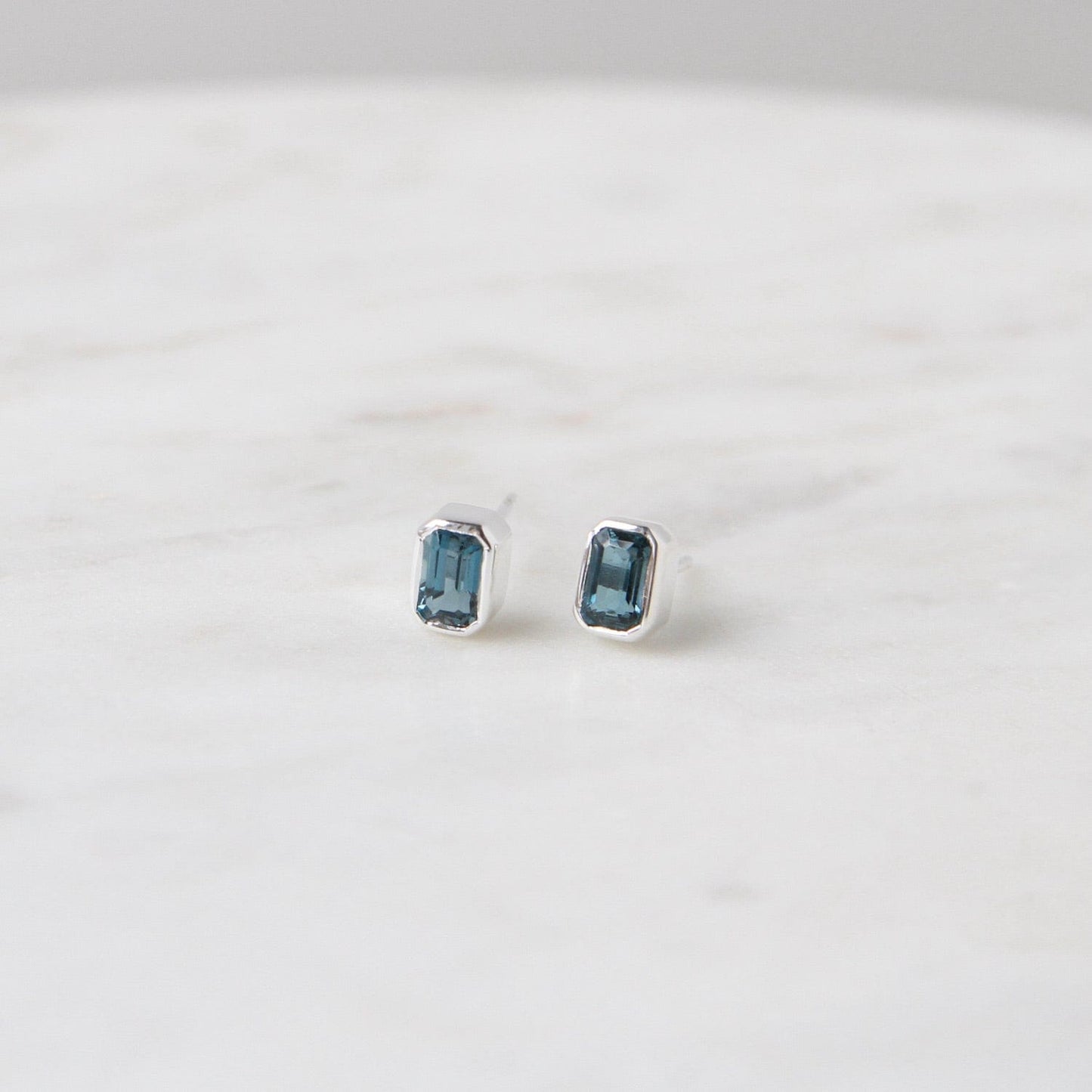 EAR Sterling Silver Bezel Set Emerald Cut London Blue Topaz