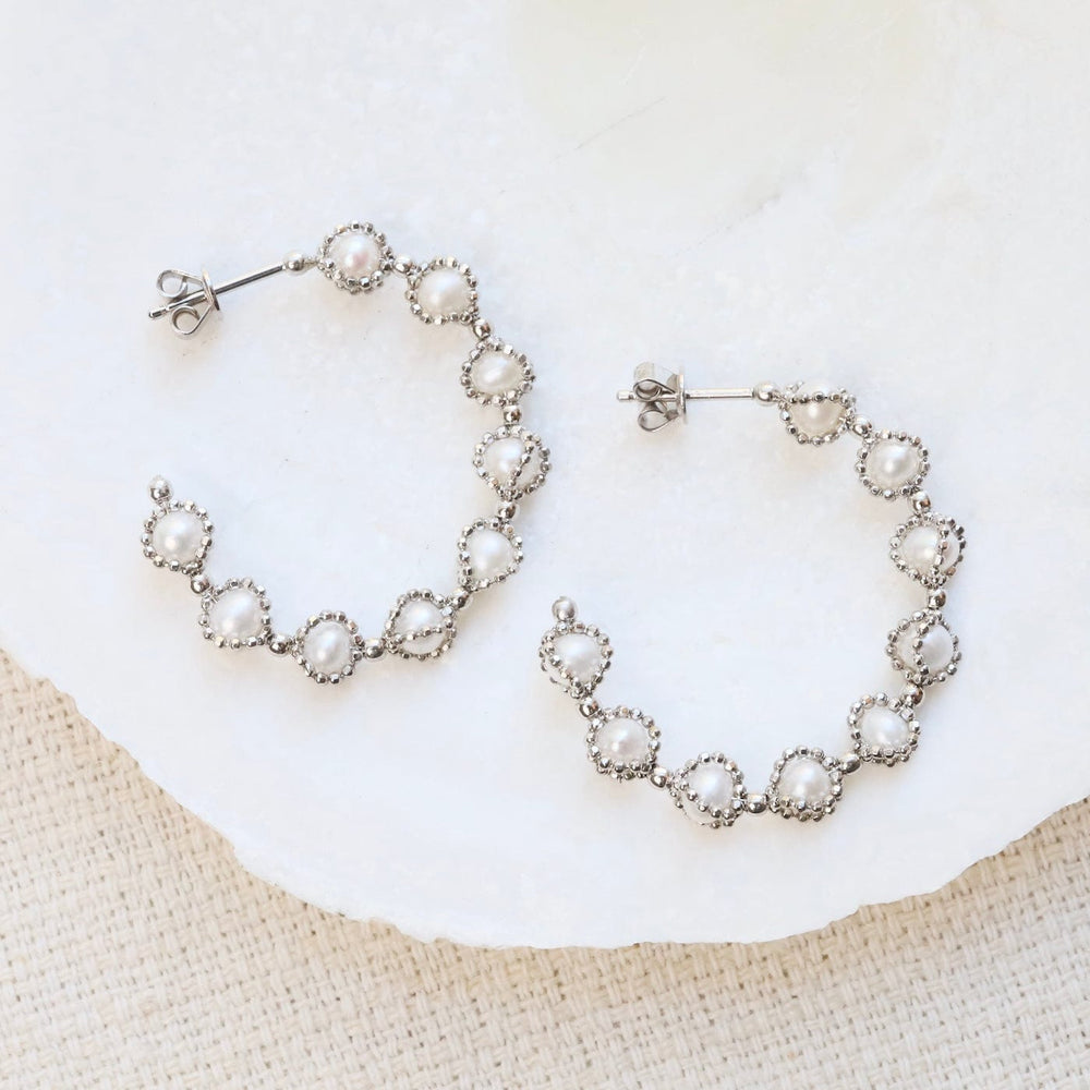 
                      
                        EAR Sterling Silver Hoops with Captured Pearls
                      
                    