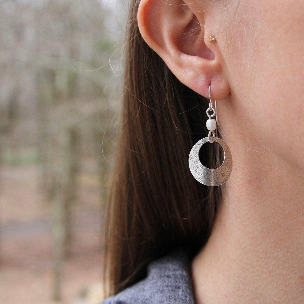 
                      
                        EAR Sterling Silver Open Disc, Slightly Folded Earring
                      
                    