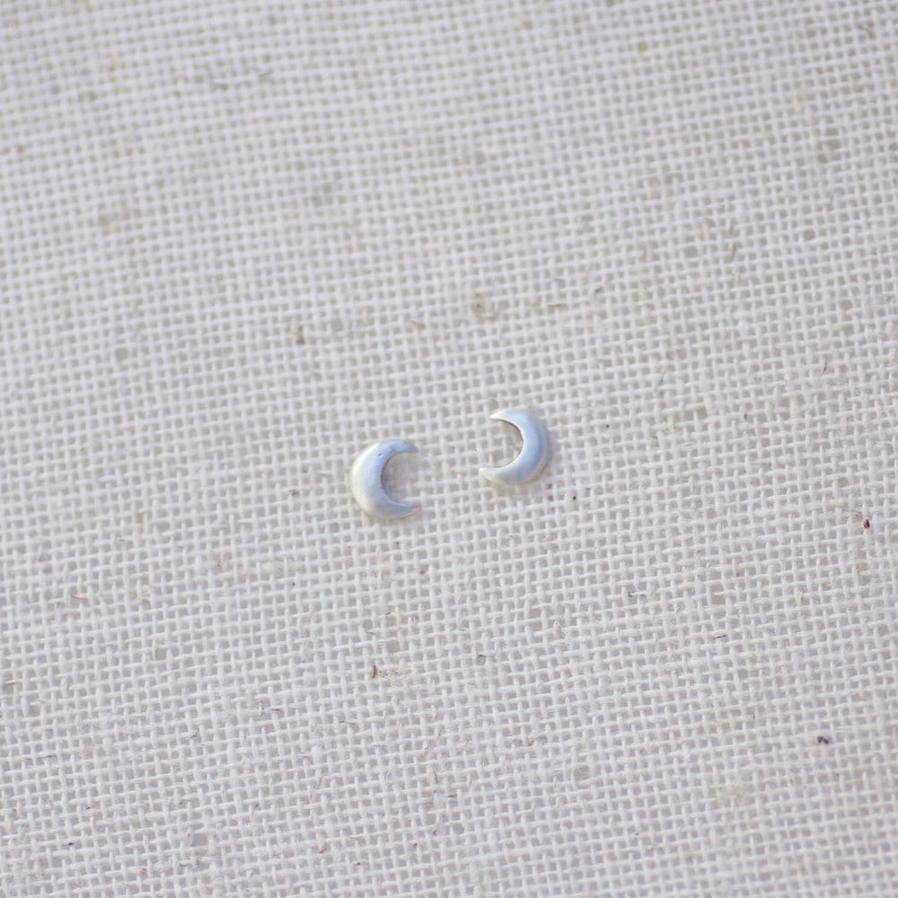 
                      
                        EAR Tiny Crescent Moon Studs - Sterling Silver
                      
                    