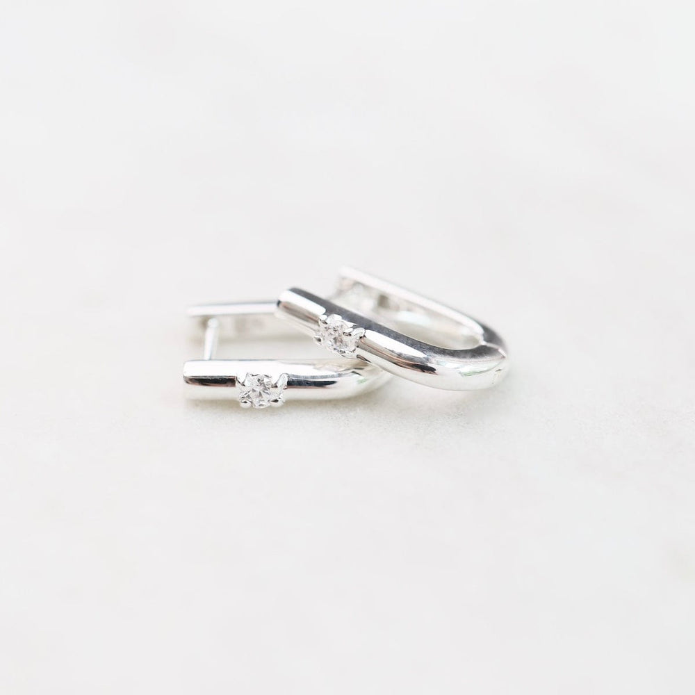 
                      
                        EAR U Shaped Huggie Hoops with CZ in Silver
                      
                    