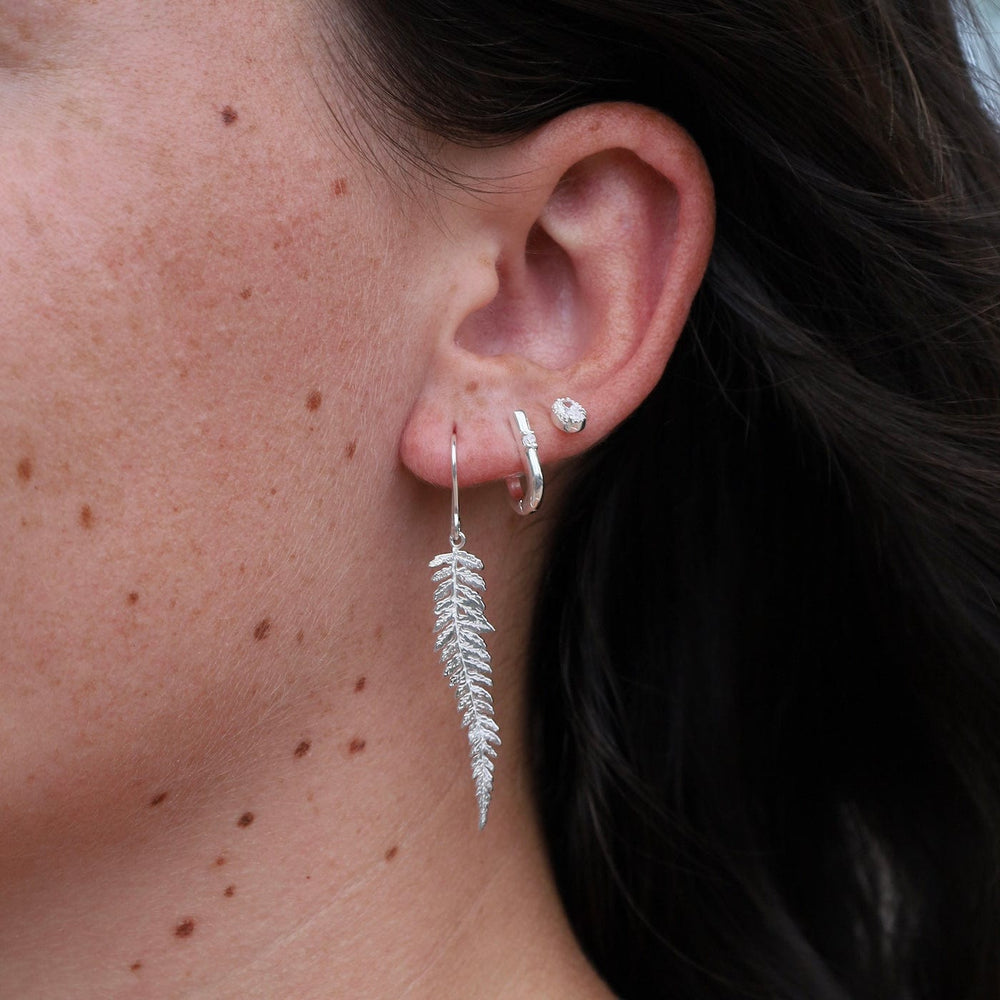 
                      
                        EAR U Shaped Huggie Hoops with CZ in Silver
                      
                    