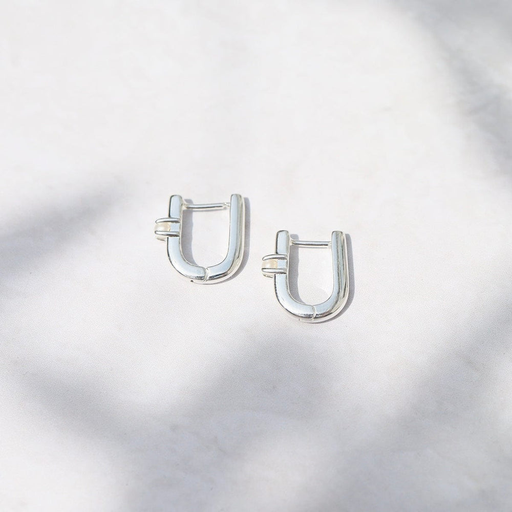 
                      
                        EAR U Shaped Huggie Hoops with Pearls - Sterling Silver
                      
                    