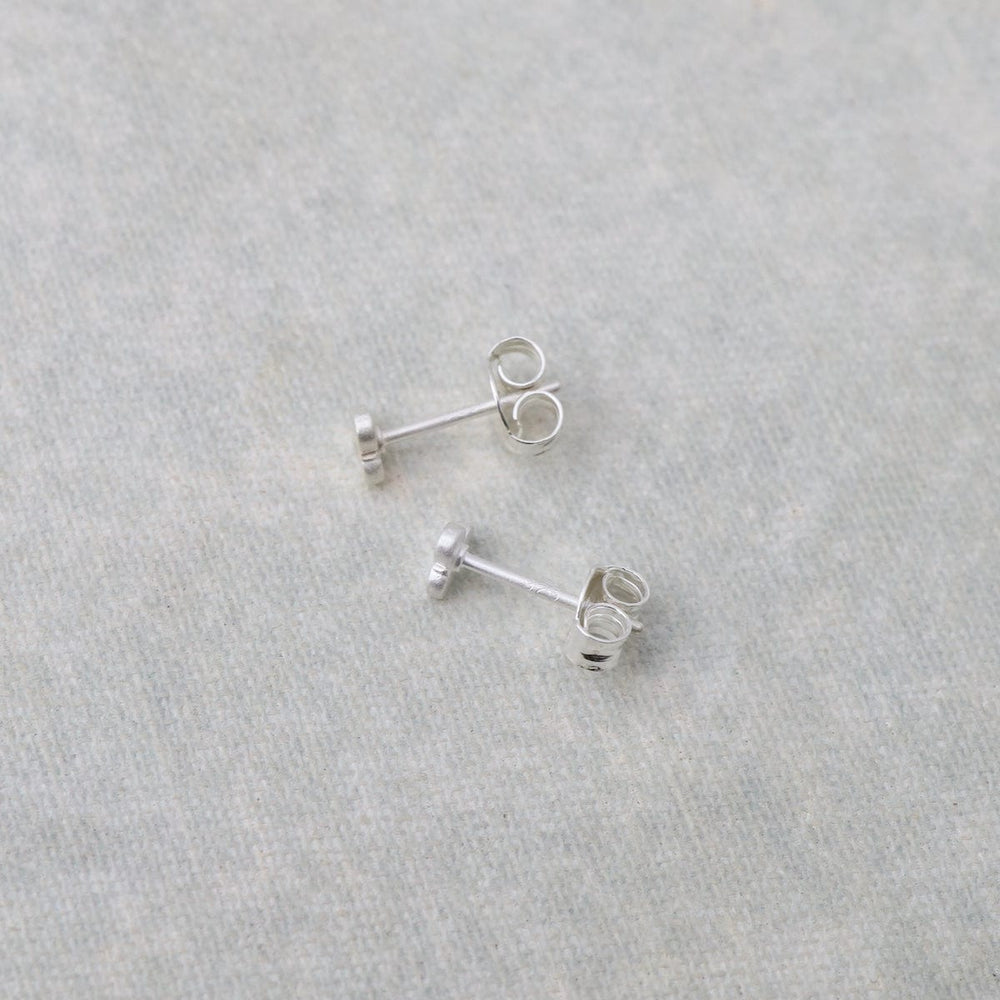 
                      
                        EAR Very Tiny 3 Disc Studs – Brushed Sterling Silver
                      
                    