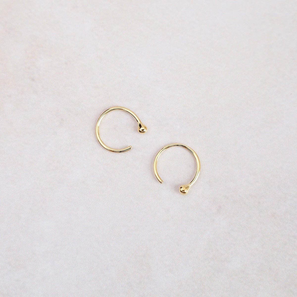 Little ball huggie hot sale hoop earrings