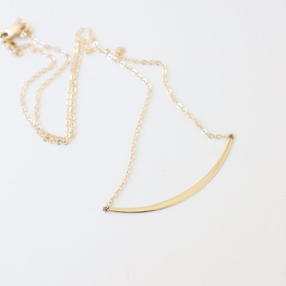 
                      
                        NKL-14K 14k Gold Half Curve Necklace
                      
                    