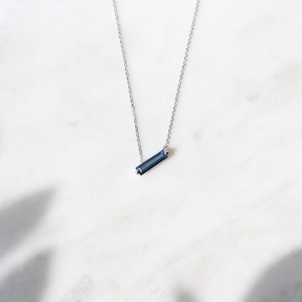 
                  
                    NKL-14K 14k White Gold English Blue Topaz Baguette Necklace
                  
                