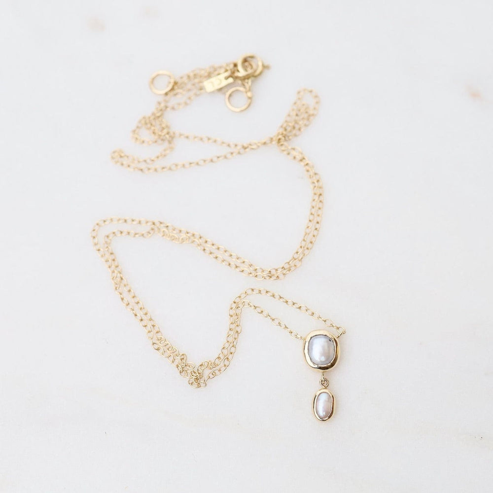 
                      
                        NKL-14K 14k Yellow Gold Bezel Set White Pearl with Tiny Drop Necklace
                      
                    