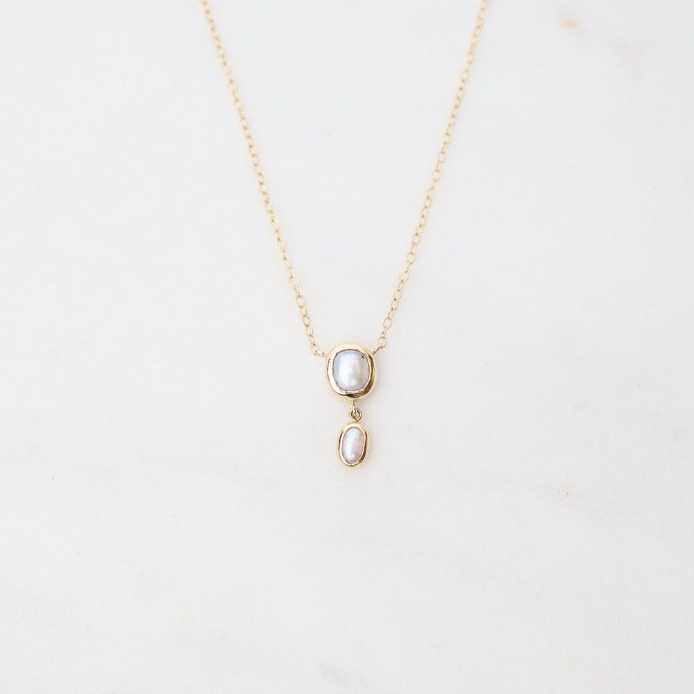 
                      
                        NKL-14K 14k Yellow Gold Bezel Set White Pearl with Tiny Drop Necklace
                      
                    