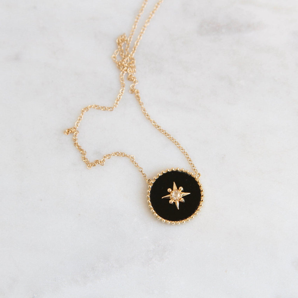 
                      
                        NKL-14K 14k Yellow Gold Black Onyx Disc with Gold Star & Diamond Center
                      
                    