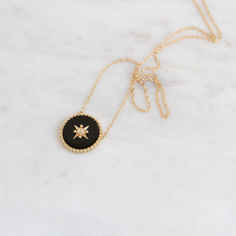 
                      
                        NKL-14K 14k Yellow Gold Black Onyx Disc with Gold Star & Diamond Center
                      
                    