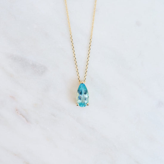 NKL-14K 14k Yellow Gold Pear Shaped Swiss Blue Topaz Necklace