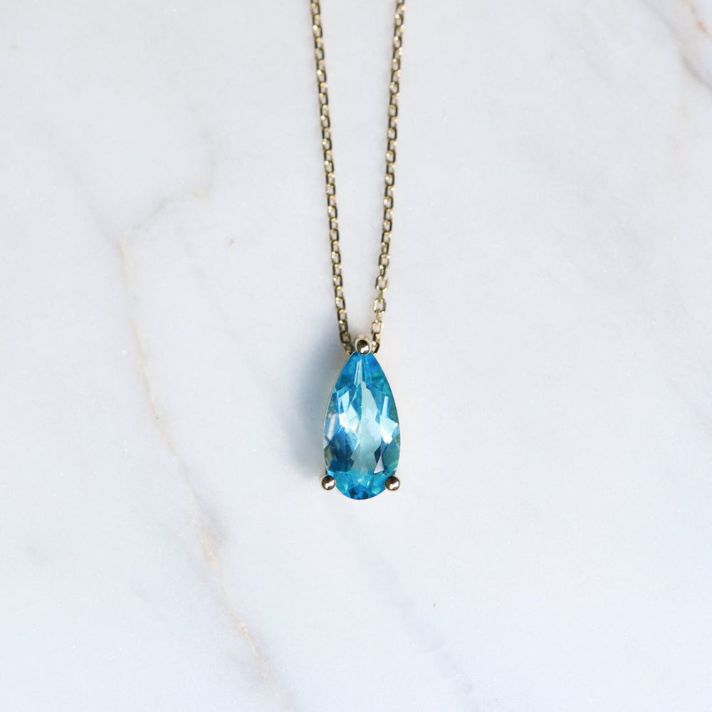 
                  
                    NKL-14K 14k Yellow Gold Pear Shaped Swiss Blue Topaz Necklace
                  
                