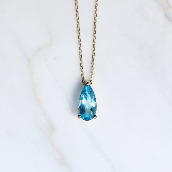 NKL-14K 14k Yellow Gold Pear Shaped Swiss Blue Topaz Necklace