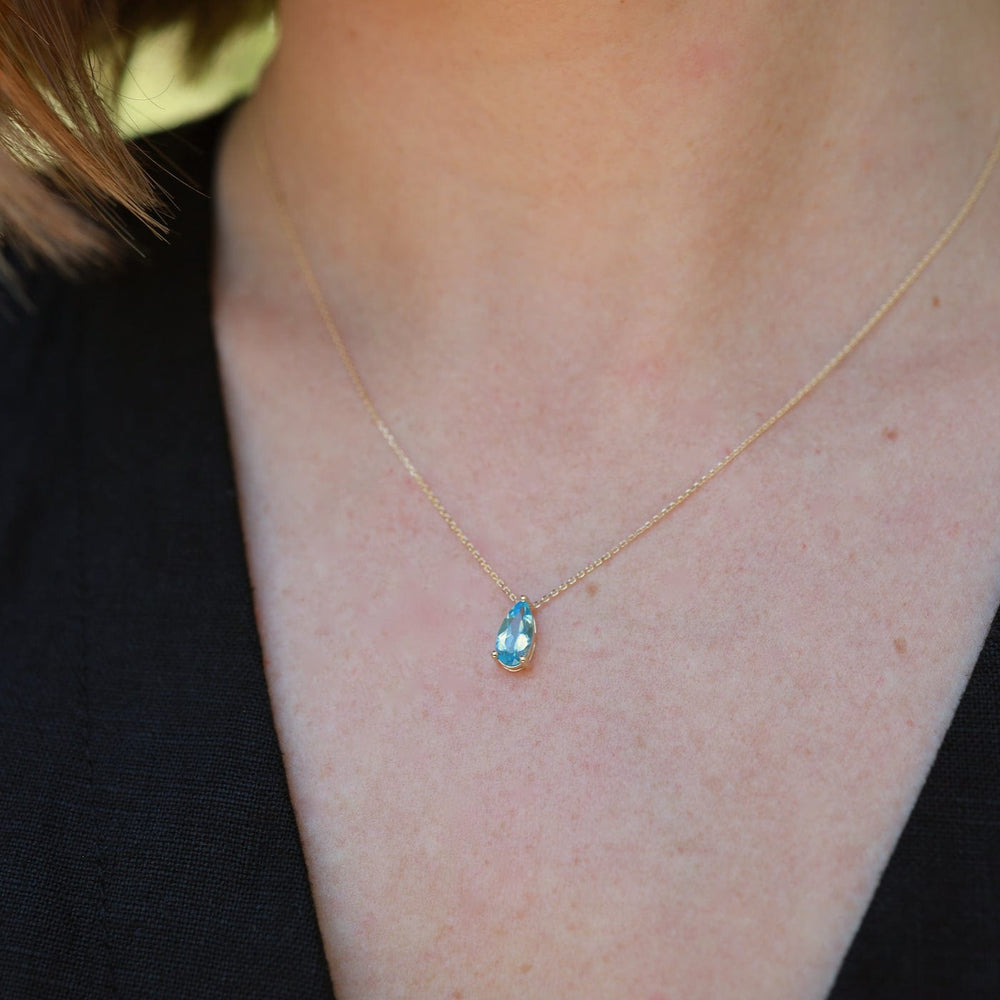 
                  
                    NKL-14K 14k Yellow Gold Pear Shaped Swiss Blue Topaz Necklace
                  
                