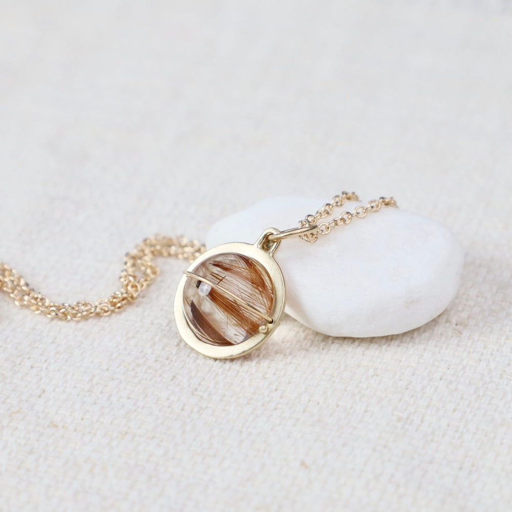 
                  
                    NKL-14K Captured Rutilated Quartz Orb Necklace
                  
                