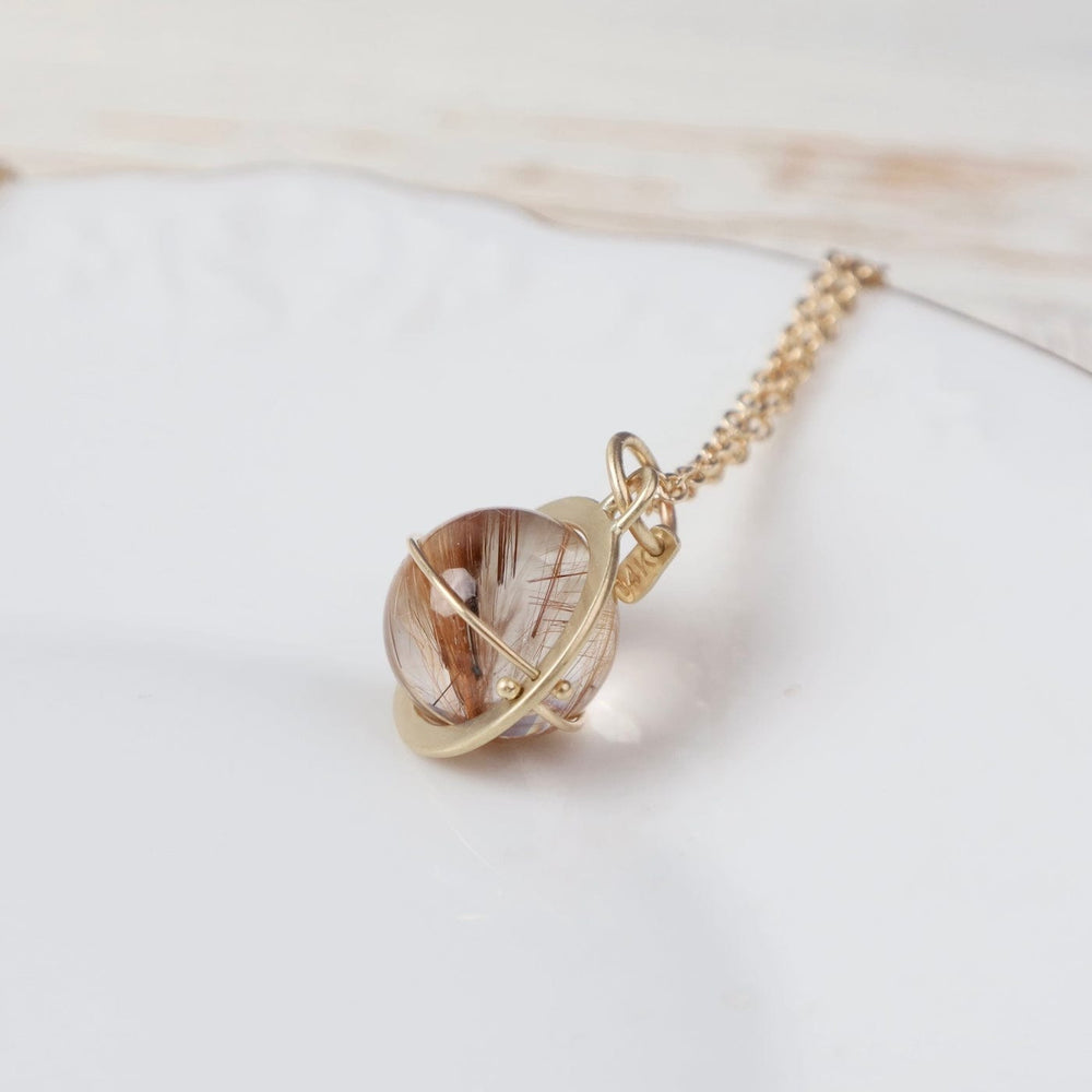 
                  
                    NKL-14K Captured Rutilated Quartz Orb Necklace
                  
                