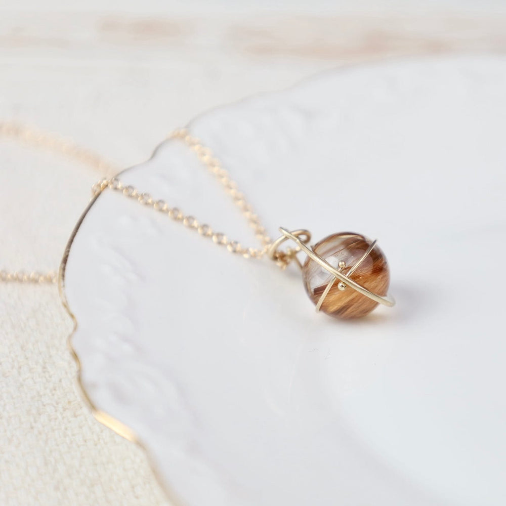 
                  
                    NKL-14K Captured Rutilated Quartz Orb Necklace
                  
                