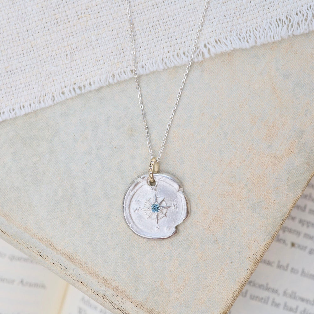 
                      
                        NKL-14K Sterling Silver & 14k Gold Compass Necklace with Montana Sapphire
                      
                    