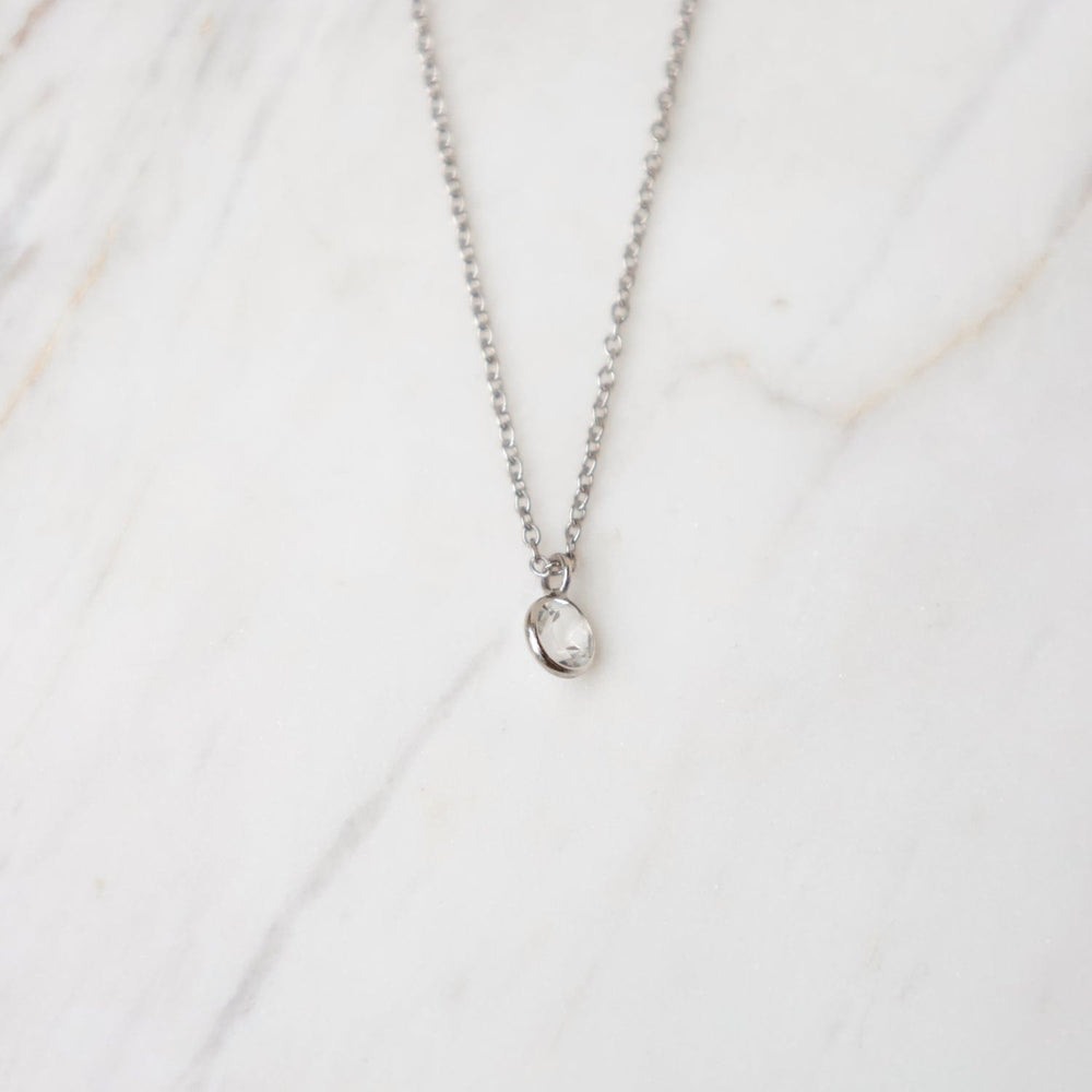 
                      
                        NKL-14K White Gold & White Topaz Solitaire Necklace
                      
                    