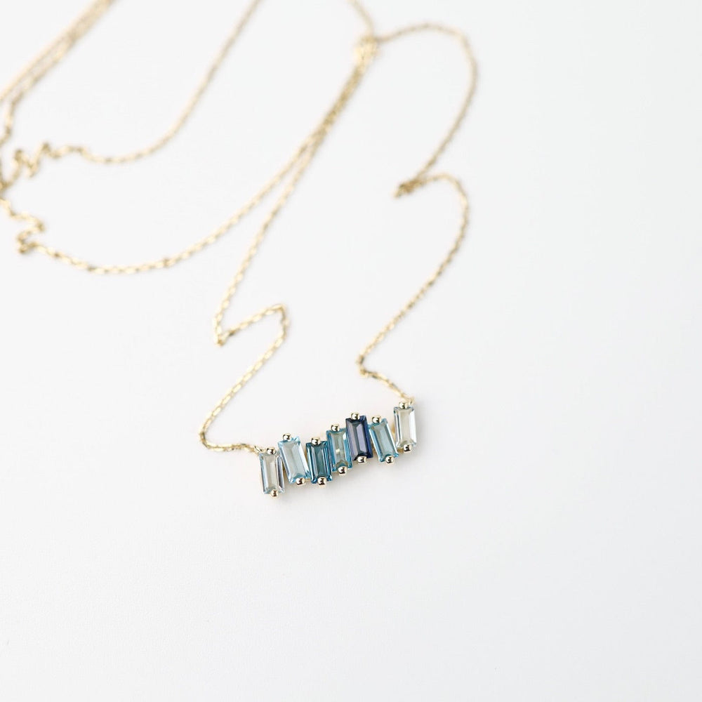 
                      
                        NKL-14K Yellow Gold Mixed Blue Baguette Bar Necklace
                      
                    