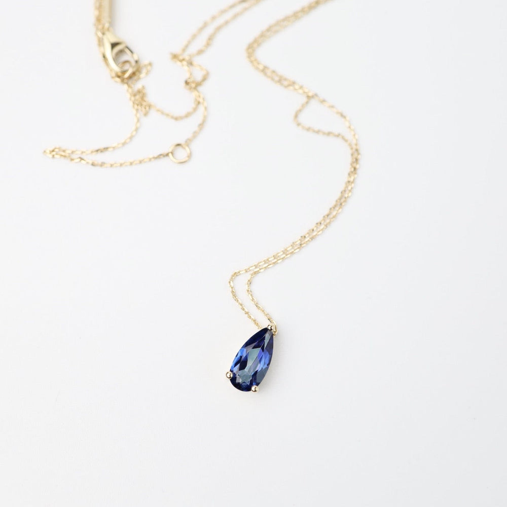 
                  
                    NKL-14K Yellow Gold Pear Shaped English Blue Topaz Necklace
                  
                