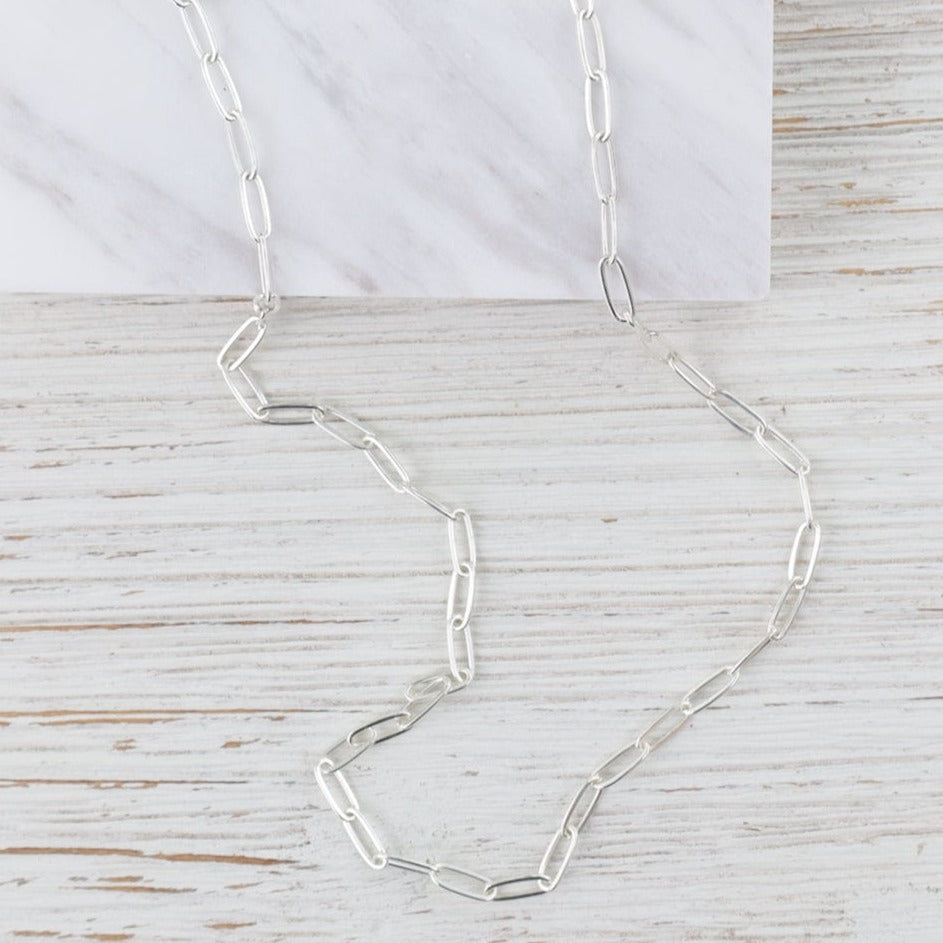 
                      
                        NKL 18" Sterling Silver Flat Drawn Cable Chain
                      
                    