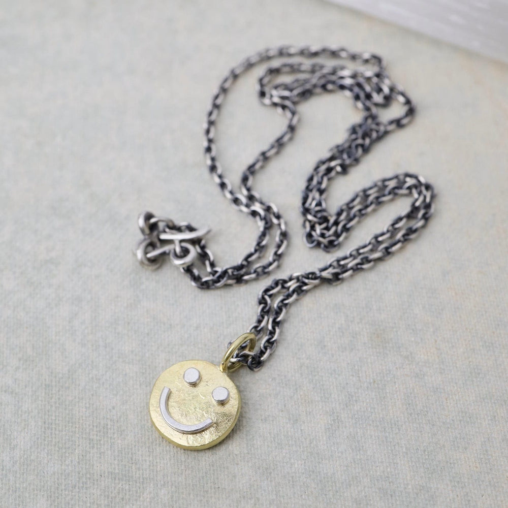 
                      
                        NKL-18K 18k Gold Tiny Happy Face
                      
                    