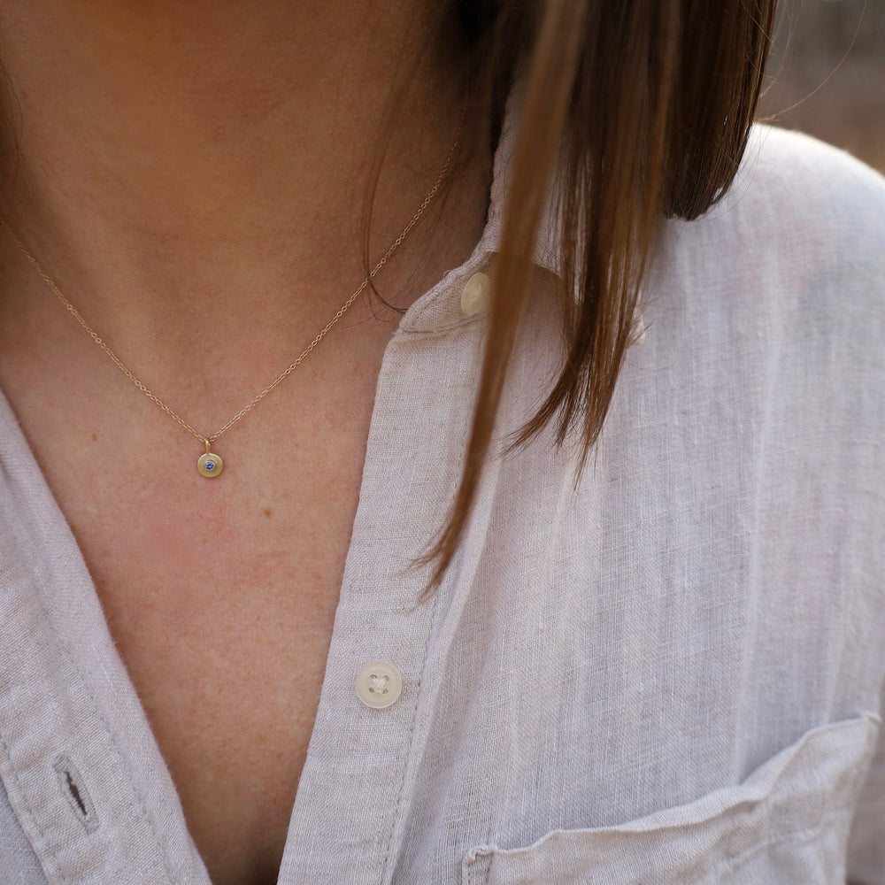 
                  
                    NKL-18K 18k Sapphire Dot Necklace
                  
                