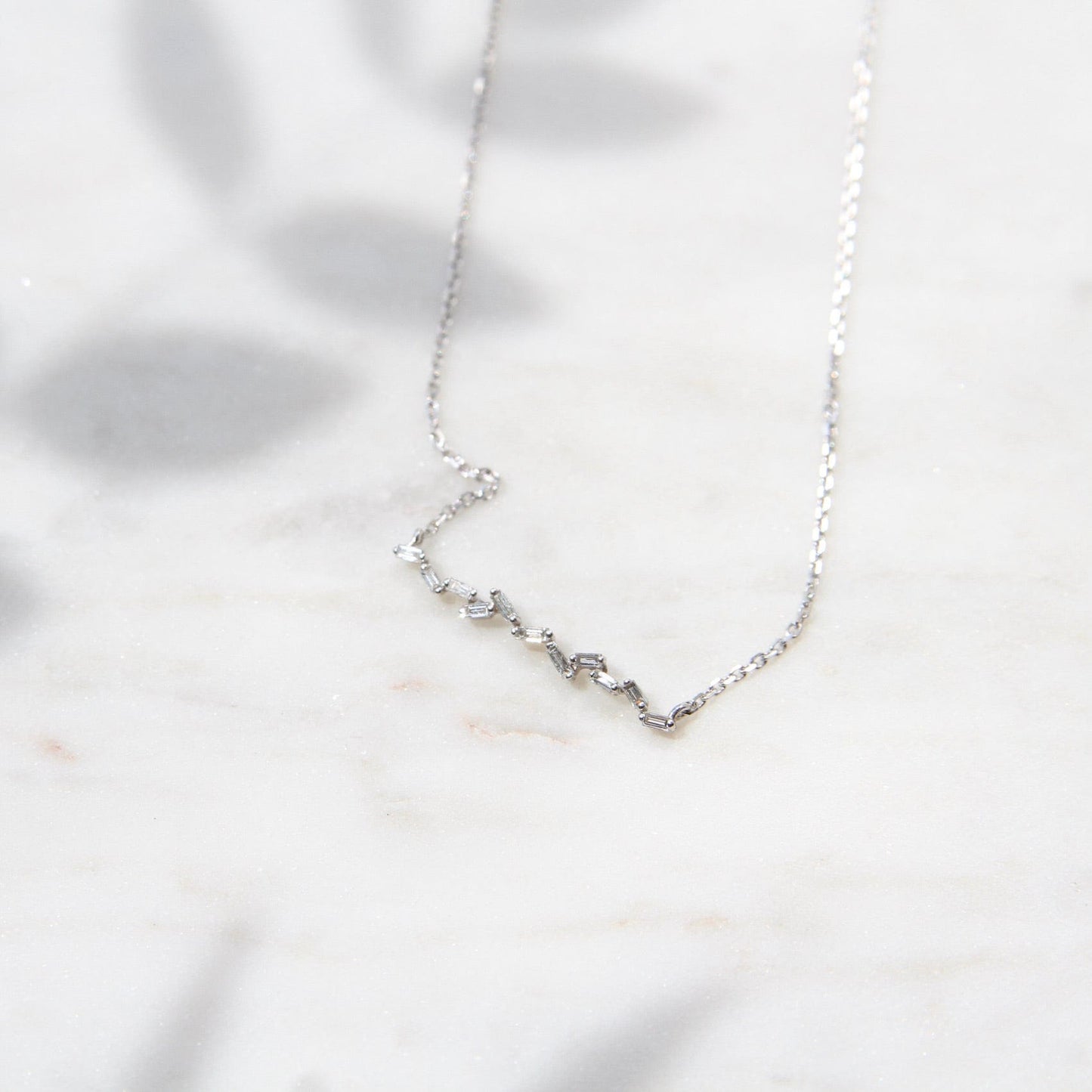 NKL-18K 18k White Gold Thin Scattered Diamond Baguette Bar